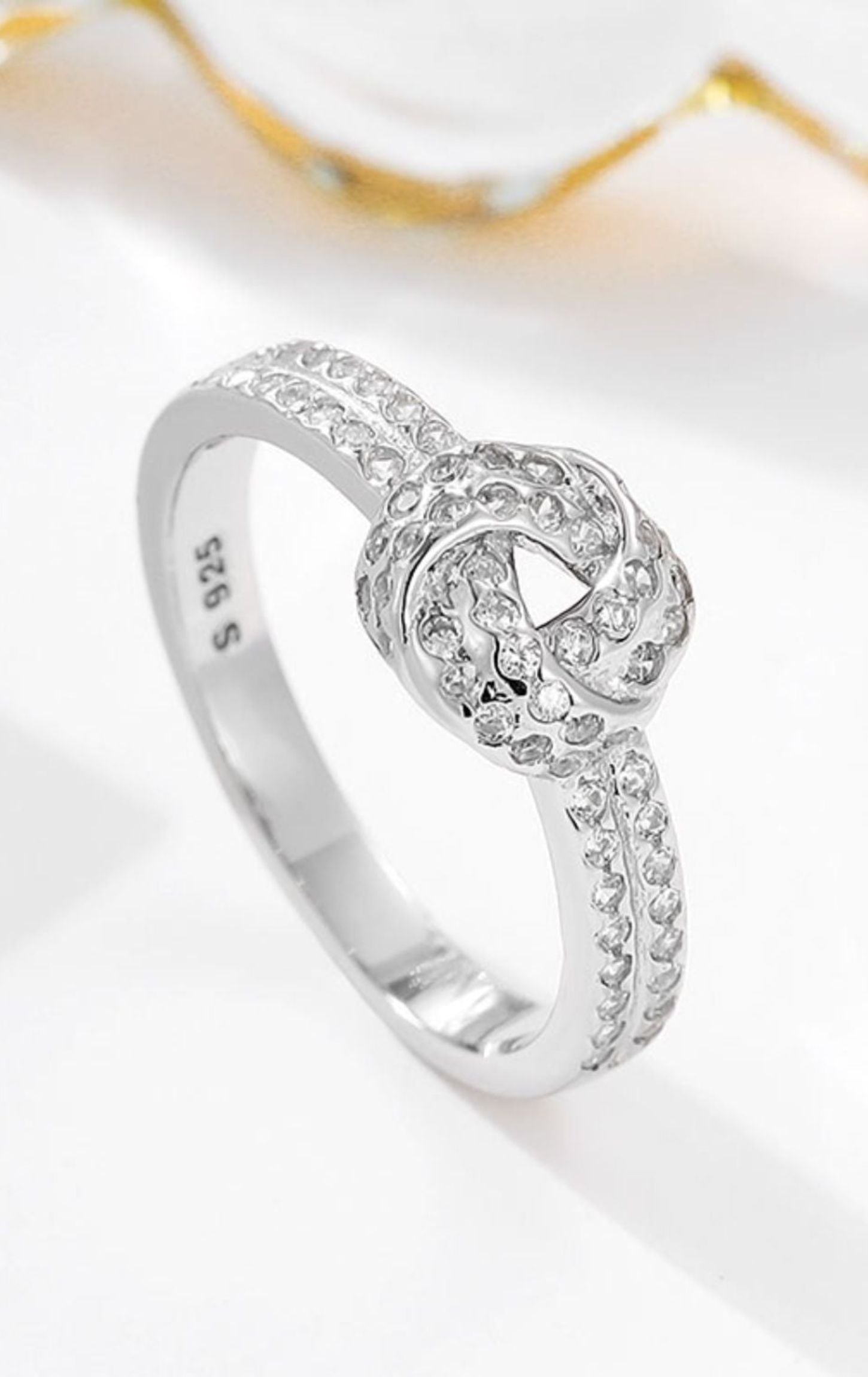Shimmering Sterling Knot Ring: A Timeless Symbol of Love and Elegance